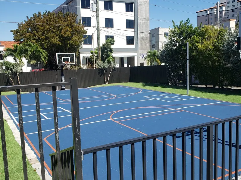 The center’s resurfaced blue outdoor court beside the building.